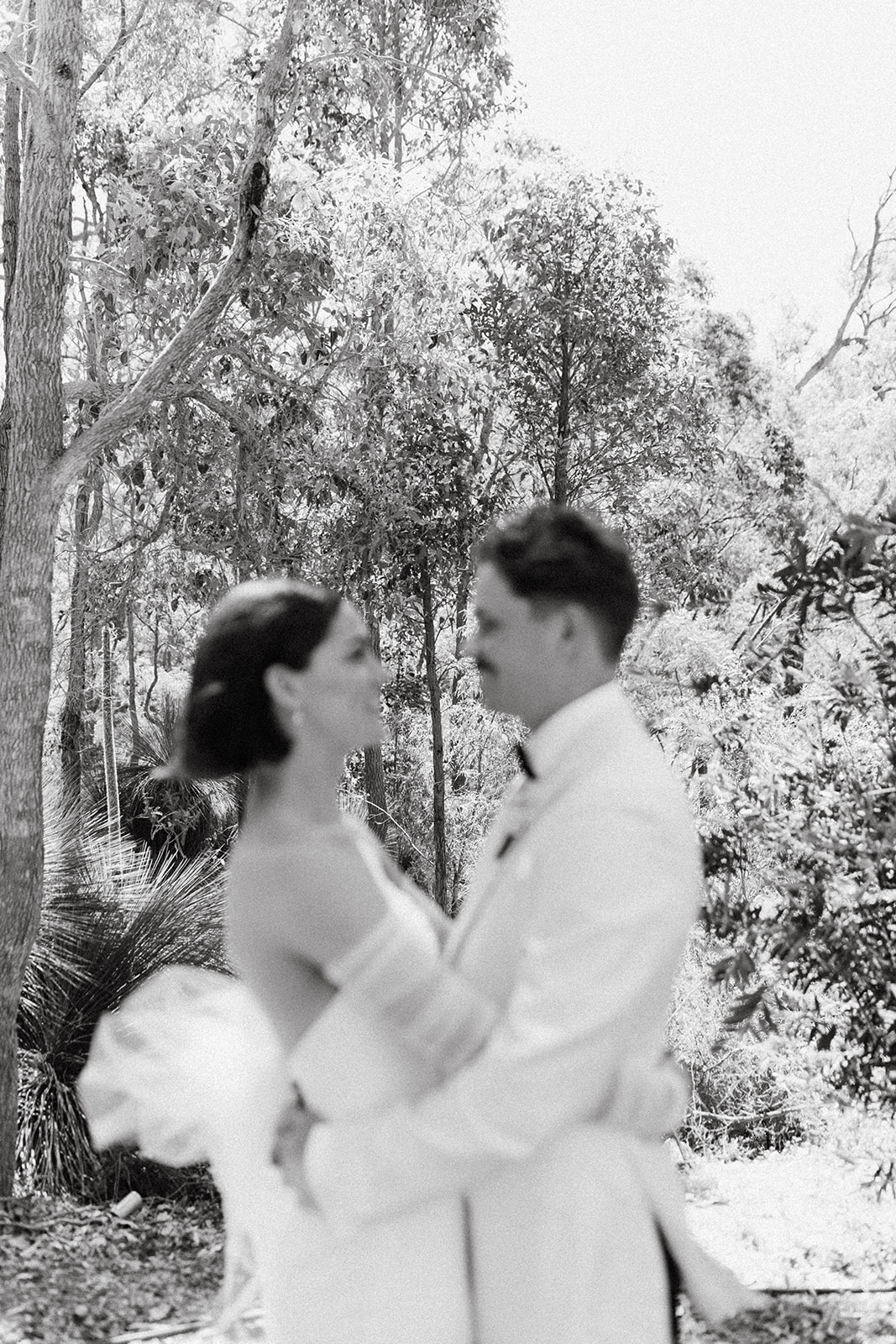 Couple sharing first look moment at laid-back rural wedding venue