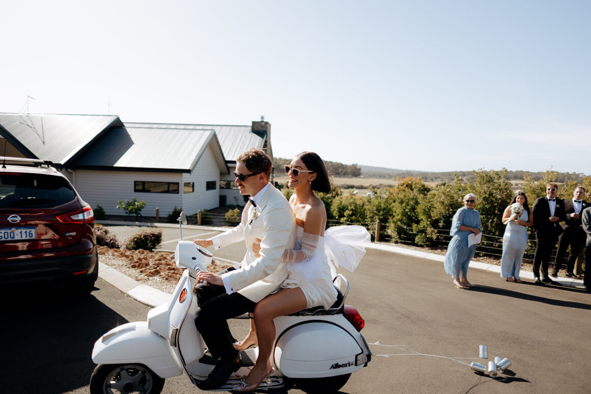 Fun candid moment of couple on Vespa captured by Emma MacAulay