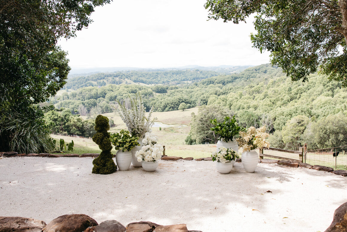 Wedding ceremony setup at Earth House with natural tones and relaxed styling