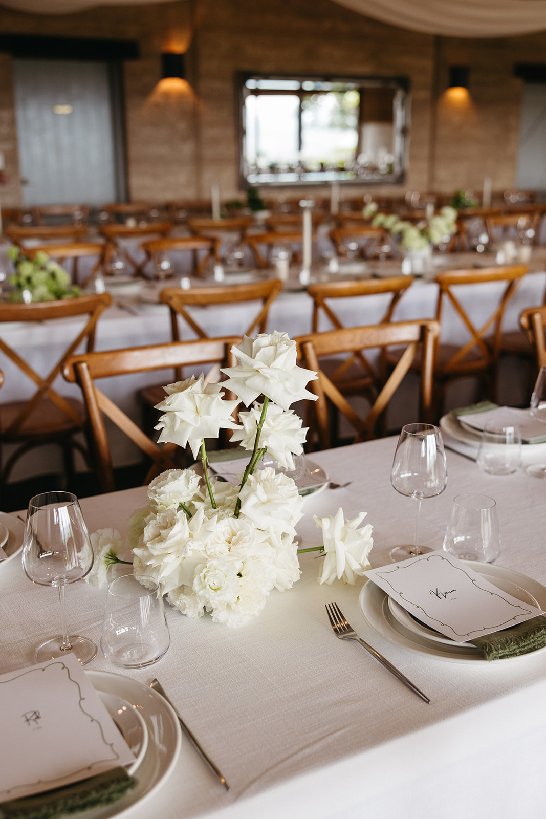 Wedding table styling with earthy tones, candles and textured linens