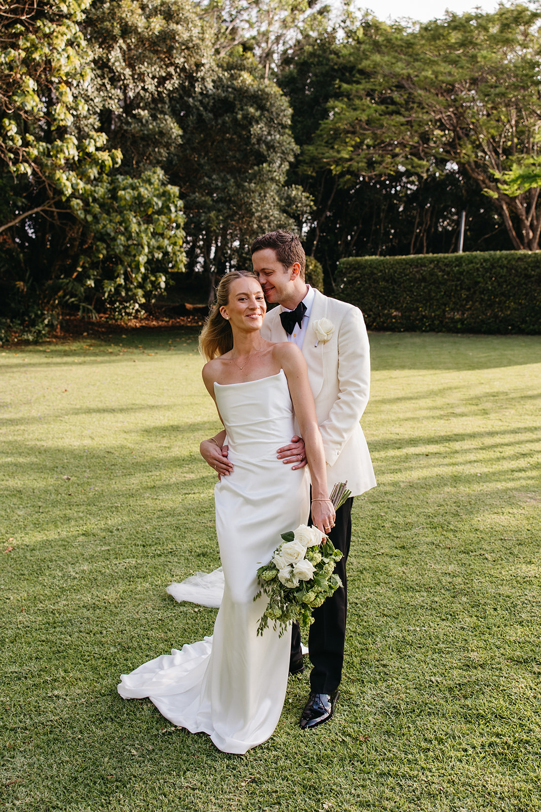 Bride and groom Bianca and Patrick embracing at Byron Bay wedding venue Earth House
