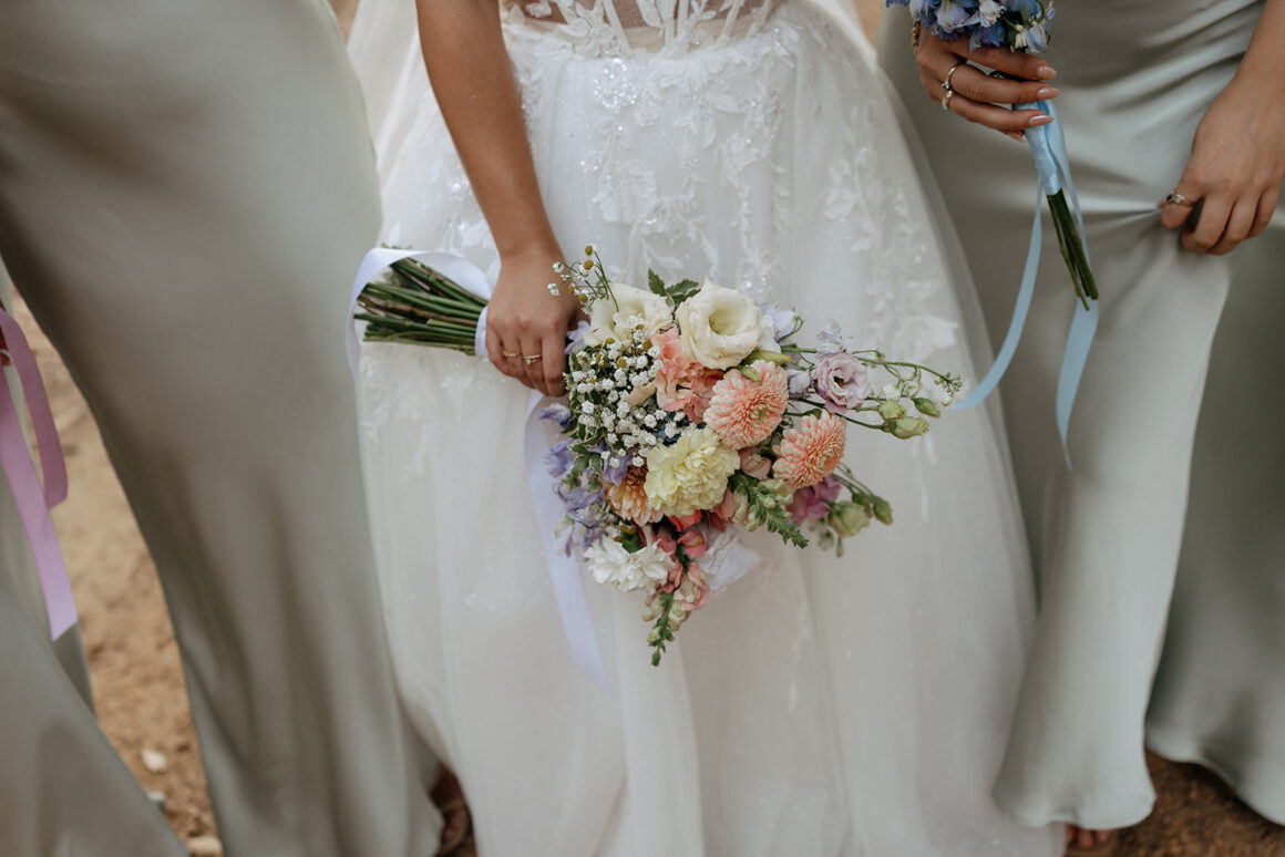 Romantic bridal bouquet with soft pastel flowers and lush greenery, styled for a modern wedding.