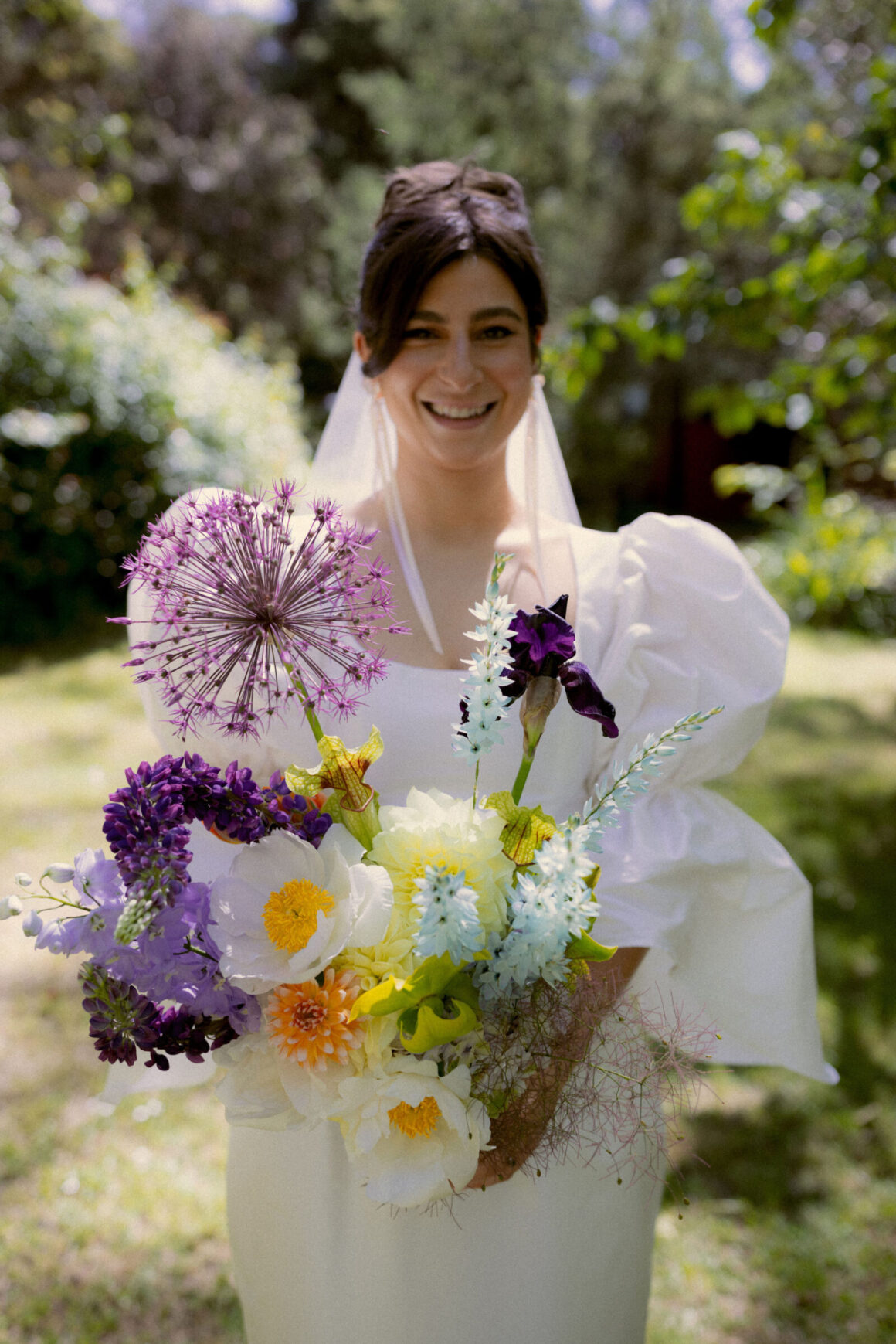 Honesty Flora Cheeky pop of colour in a wedding bouquet with mixed flowers, wild textures, and playful floral accents.