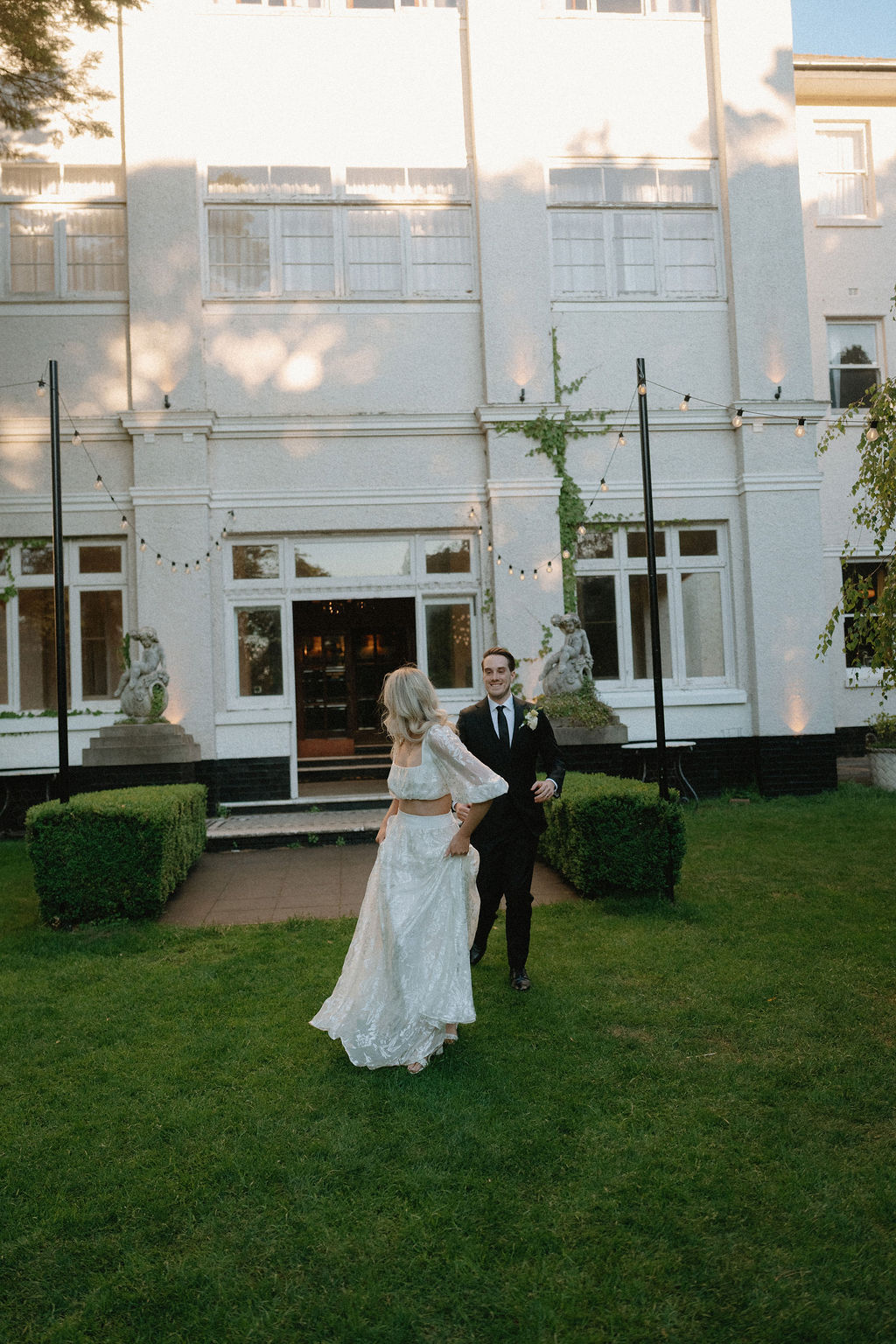 bride and groom at The Robertson Hotel in Grace Loves Lace and Institchu
