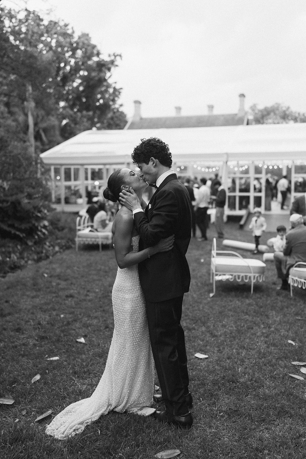 Romantic black and white couple portrait in Melbourne gardens with natural greenery backdrop