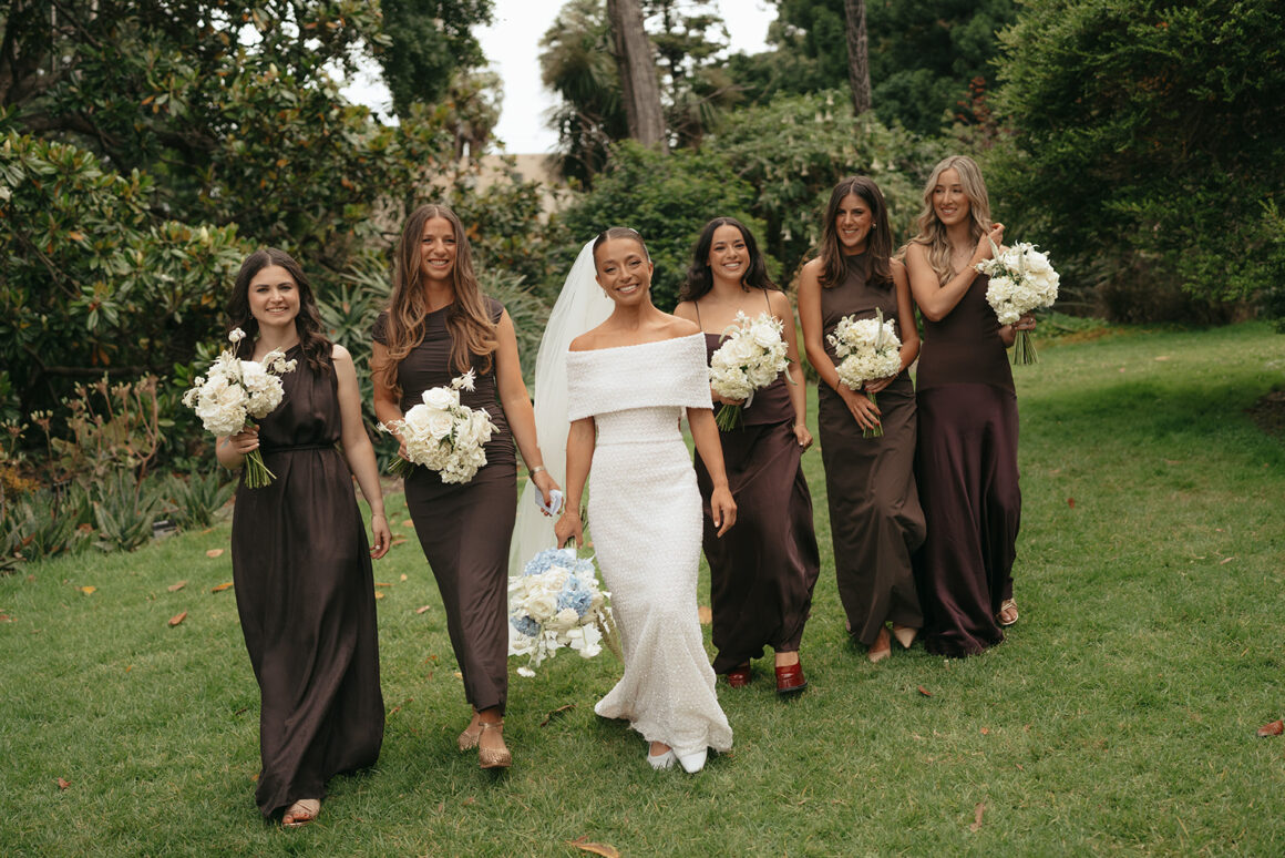 bride and bridal party in brown bridesmaids gowns
