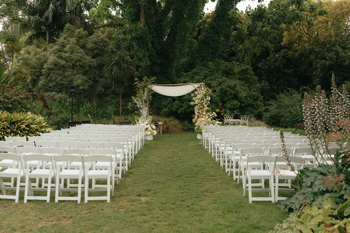 outdoor ceremony at Gardens House with relaxed family garden party vibe and luxury wedding florals