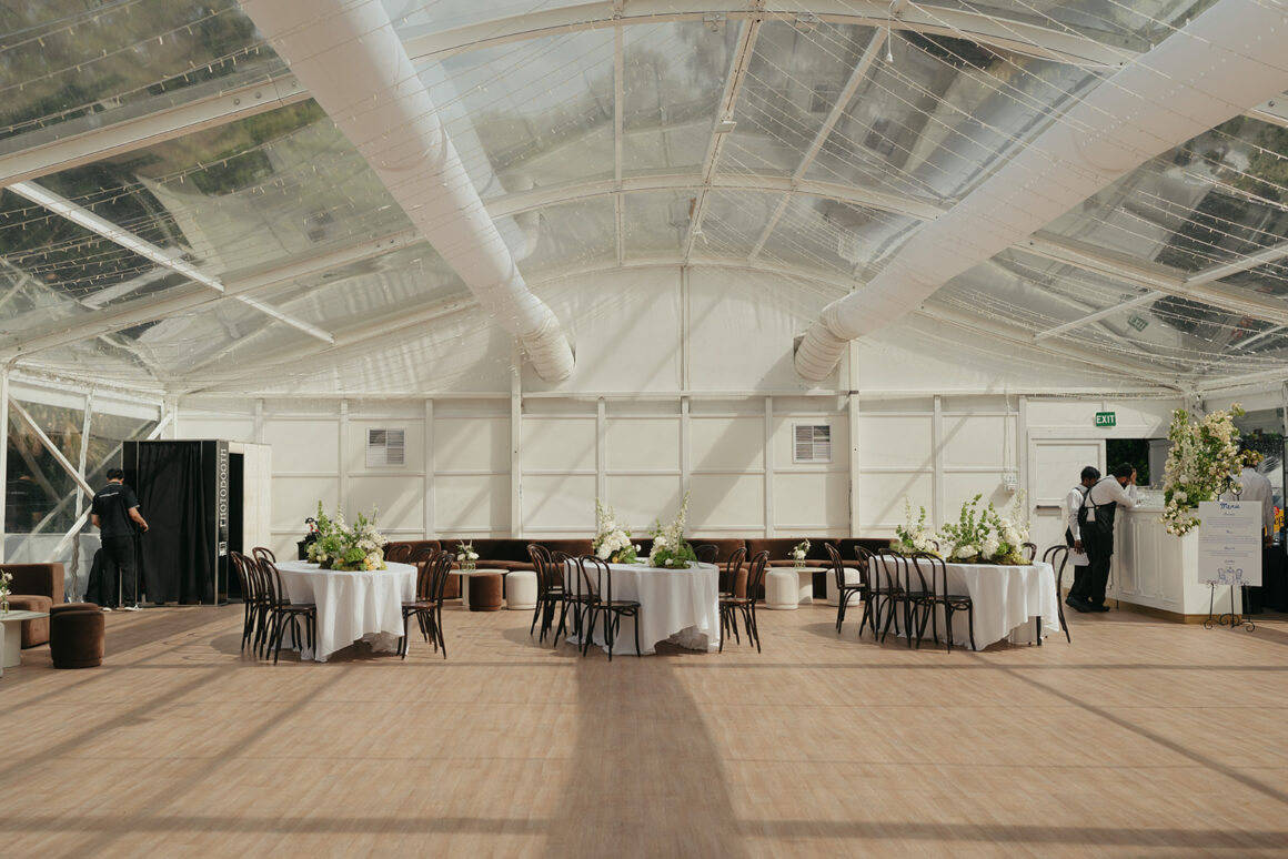 Large garden wedding reception in Melbourne with cocktail-style setup and earthy colour palette