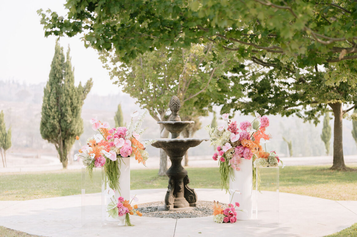 Vibrant pink and orange wedding florals styled at Glenbosch Estate vineyard in regional Victoria