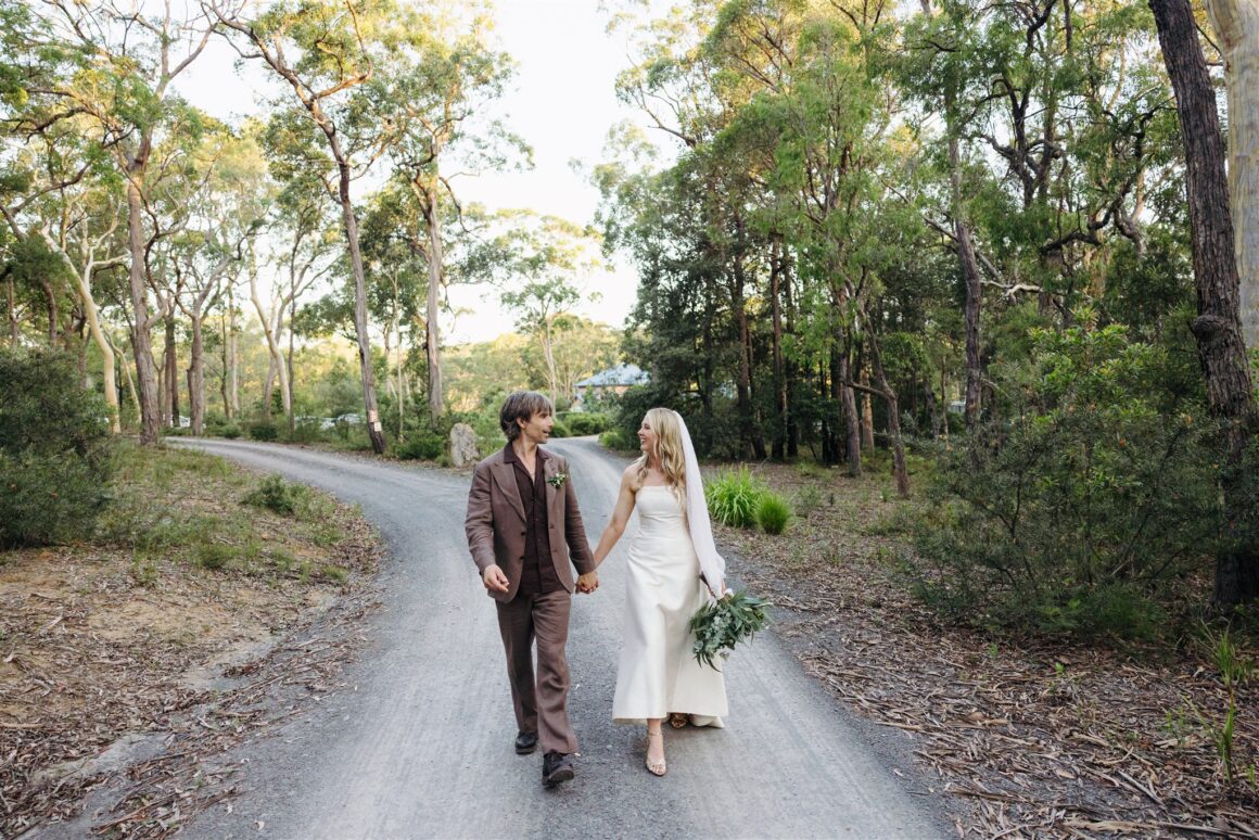 Bride in vintage wedding dress and groom in M.J. Bale suit at Wildwood