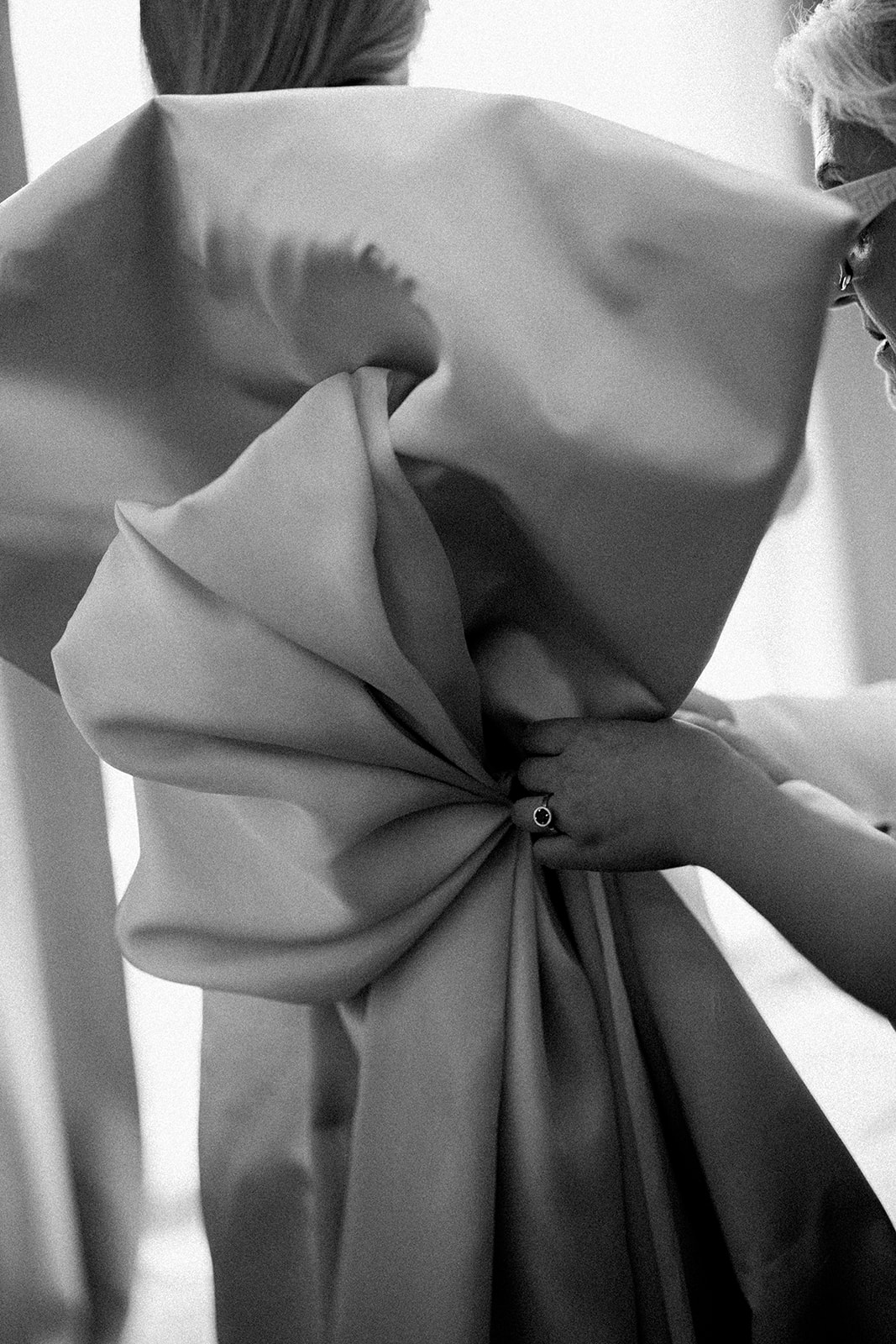 lose-up detail of large back bow on custom-designed silk wedding gown – bride-designed dress at Melbourne church wedding, photography by Kinship by Kristy