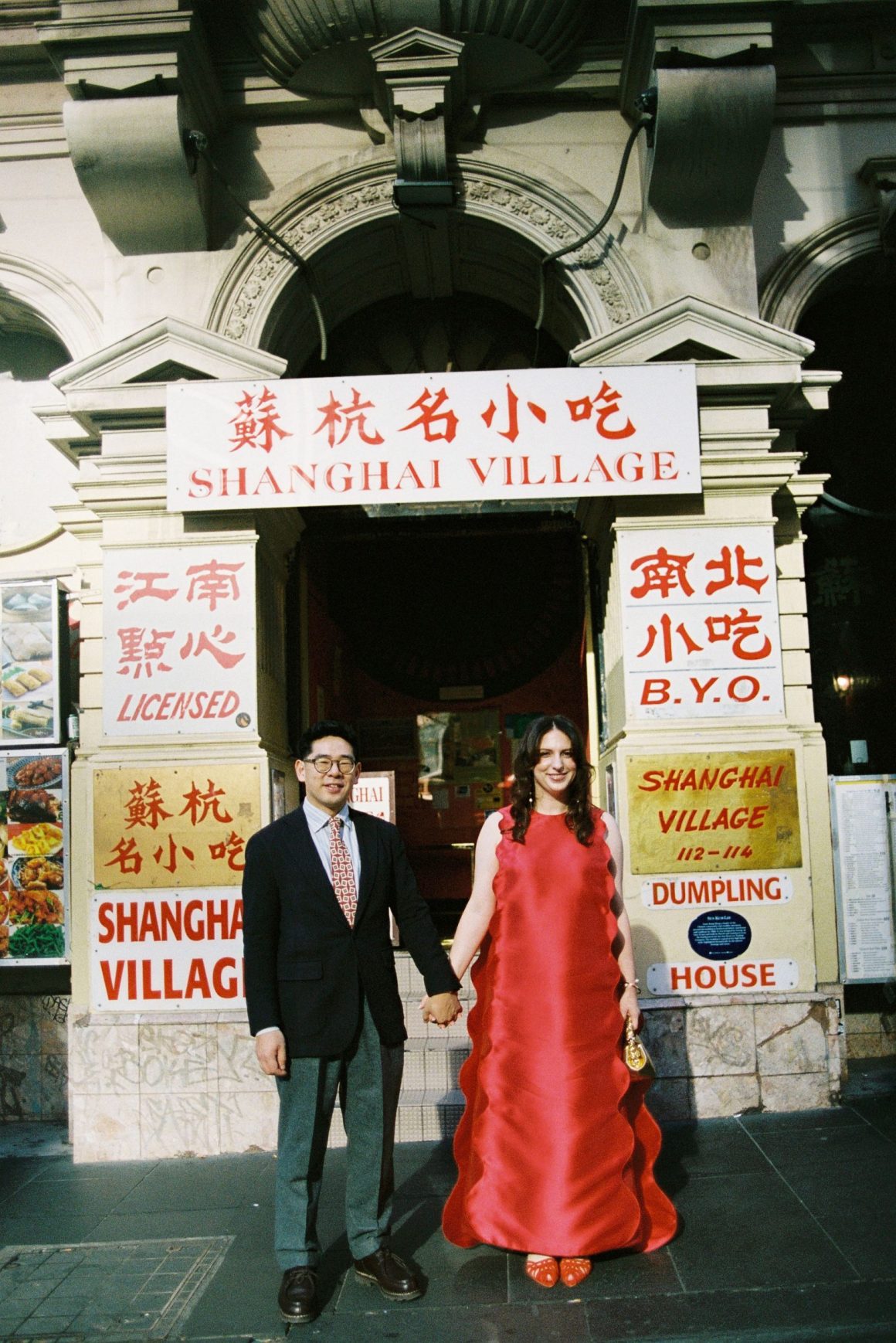 Tash wearing a custom red Perple wedding dress during her Chinese tea ceremony in Fitzroy, Melbourne.